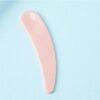 Cera-Di-Cupra Creme en Make-Up-spateltje roze met blauwe achtergrond